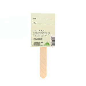 Rückseite eines Gurken-Saatgut-Sticks aus Holz mit Beschriftungsfeld "von" und "für" sowie Produktinformationen.