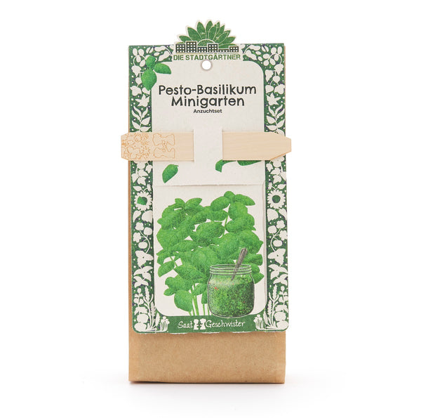 Anzuchtset âPesto-Basilikum Minigartenâ von Die StadtgÀrtner, Verpackung mit Illustration von Basilikum und einem Glas Pesto.
