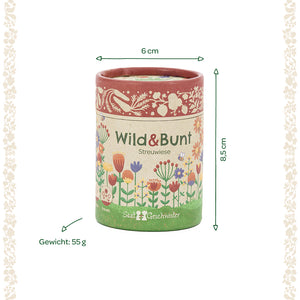 Runde Dose mit der Aufschrift "Wild & Bunt Streuwiese", verziert mit bunten Blumen, Maße 6 cm Durchmesser und 8,5 cm Höhe, Gewicht 55 g.