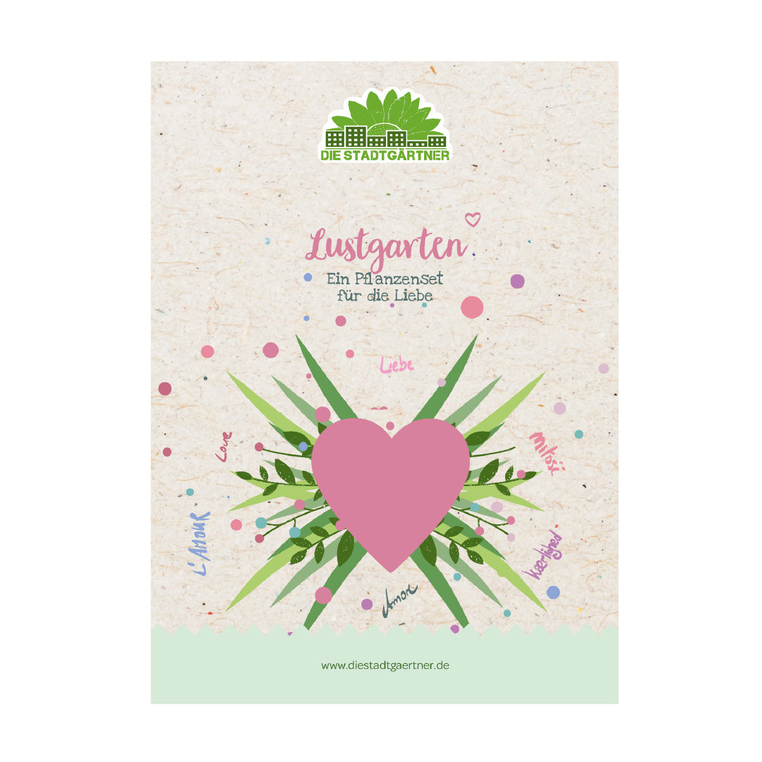 Verpackung eines Pflanzensets mit einem großen rosa Herz, grünen Blättern und dem Schriftzug „Lustgarten – Ein Pflanzenset für die Liebe“ auf beige Hintergrund.