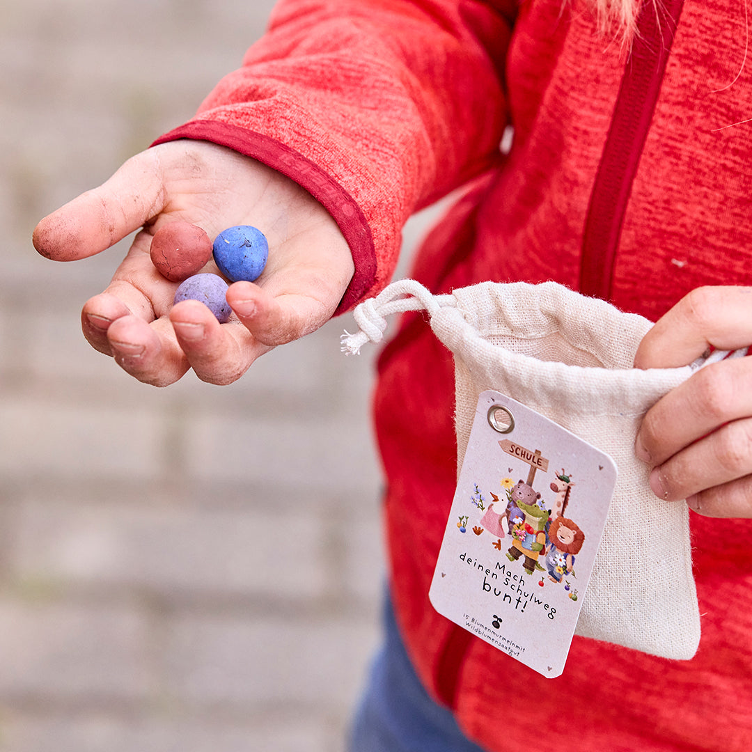 15 seed balls in a cotton bag