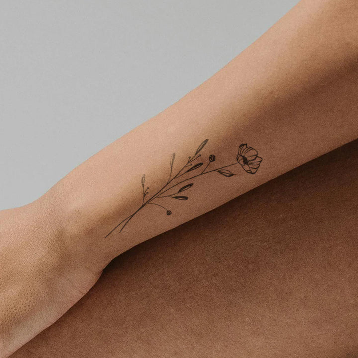Subtle Poppy Flower Tattoo